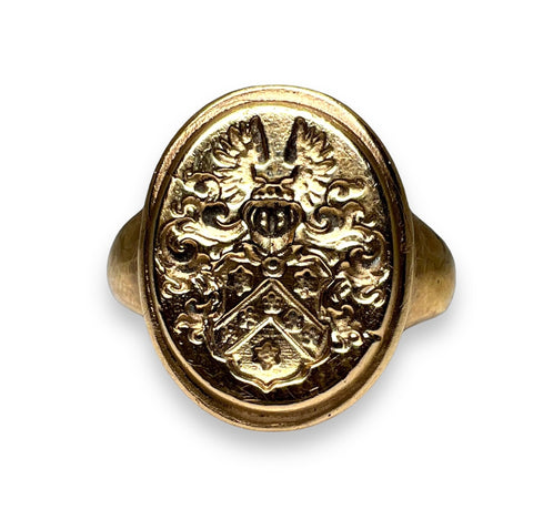 Signet gold ring.